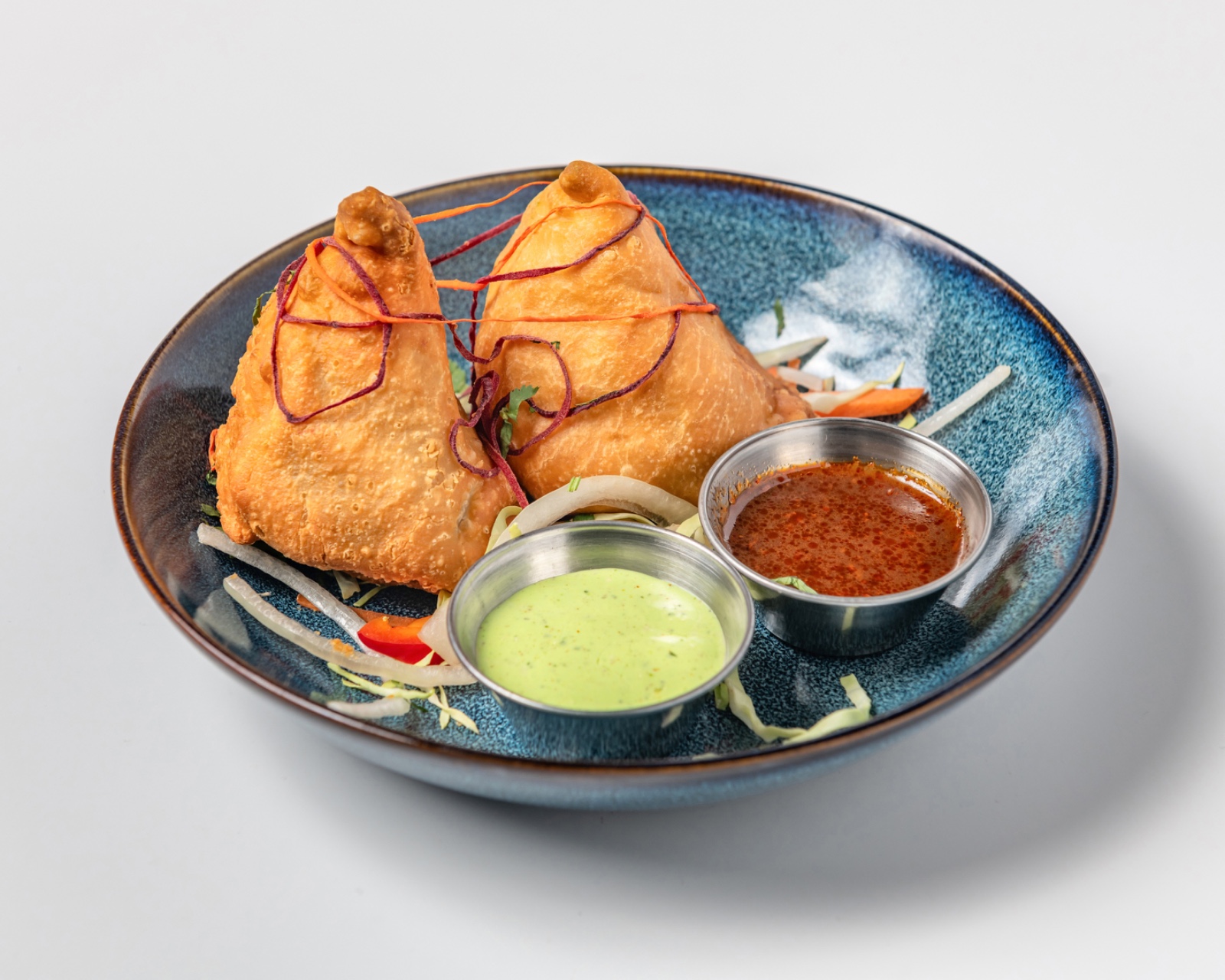 Samosa - Crispy triangular pastries filled with spiced potatoes and peas